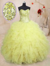 Dramatic Sleeveless Organza Floor Length Lace Up Sweet 16 Dress in Light Yellow with Beading and Ruffles